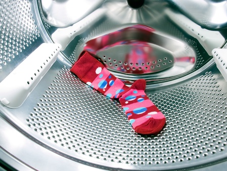 Do not forget the red or colorful  sock in a washing machine!の写真素材