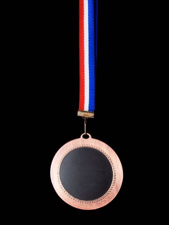 The medal turned to the dark side isolated on a black background ...の写真素材