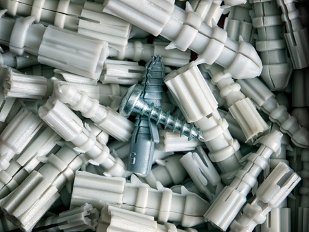 Lot of plastic straddling dowels and one screw...