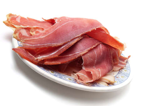 Closeup view of ham slices on a plateの写真素材