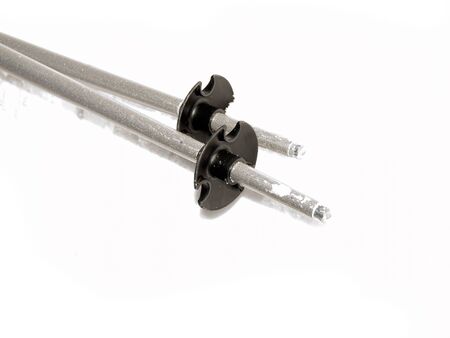Two ski sticks on a white background 