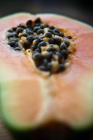 Cut papaya showing its seedsの写真素材