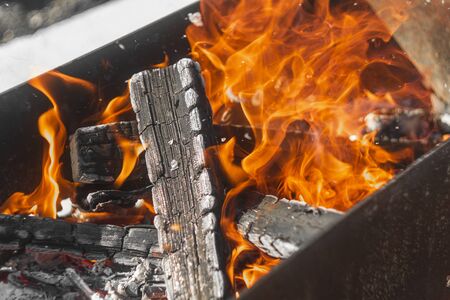 wood is burning in the grill. grill with coalsの写真素材