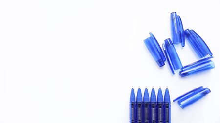 blue ballpoint pens on a white backgroundの写真素材
