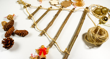 step by step instructions. step 2 making an unusual Christmas tree. christmas tree made of tree branches photoの写真素材