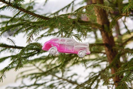 old Christmas toy weighs on the Christmas treeの写真素材