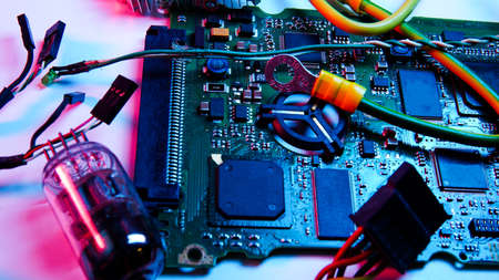wires, electrical circuits, and electric boards . red and blue illumination, cyberpunk.