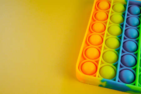 Pop it fidget toy anti-stress toy pop it, burst bubbles, the development of fine motor skills of hands and fingers. children's educational game Pop it. flexible touch toy fidgetの写真素材