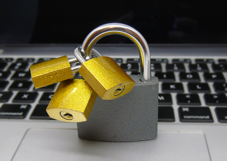Padlocks on Laptop Keyboard - Data Protection Concept