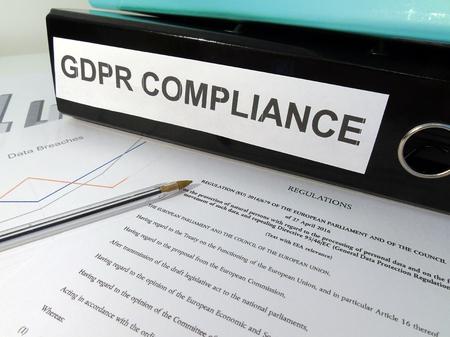 General Data Protection Regulation (GDPR) Compliance Lever Arch Folder on Cluttered Desk