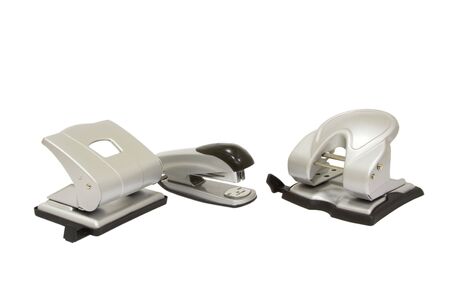 Two hole punchers and stapler isolated on whiteの写真素材