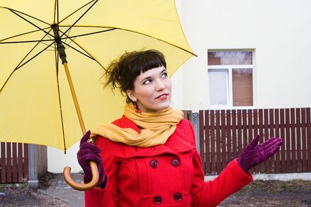 beautiful girl on red coat with yellowの写真素材