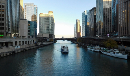 Chicago River Surrounded By Skyscrapers, Blue Sky Reflection In Water Surfaceの写真素材