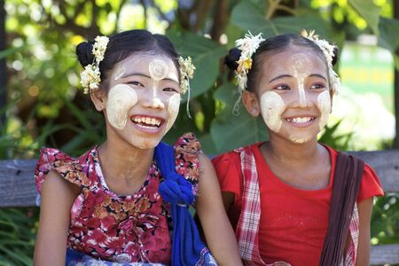 Bagan, Myanmar - October 15, 2011: Unidentified children wearing traditional Thanaka cream in Bagan, Myanmar on October 15, 2011.のeditorial素材