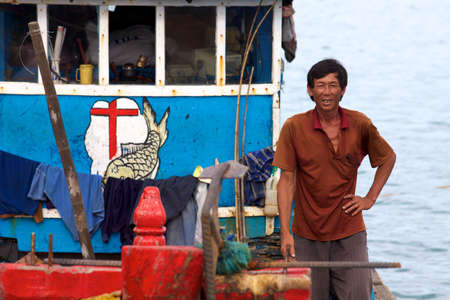 CON DAO ISLAND, VIETNAM - JUNE 26: Unidentified Vietnamese Man on fishing boat June 26, 2010 at Con Dao Island, Vietnam.のeditorial素材