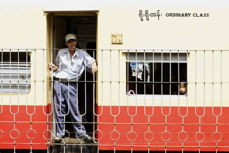 Yangon, Myanmar - October 16: Passengers aboard a train in Yangon, Myanmar on October 16, 2011. のeditorial素材