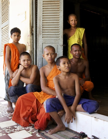 SIEM REAP, CAMBODIA-JAN 25: A Buddhist monk holding monastery sign at Wat Chowk in Siem Reap on January 25, 2012. のeditorial素材