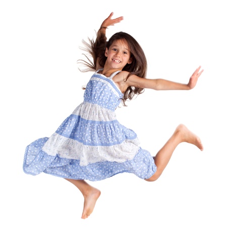Jumping happy little girl, isolated on whiteの写真素材