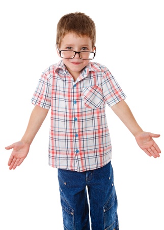 Surprised little boy in glasses that shrugging aside, isolated on whiteの写真素材