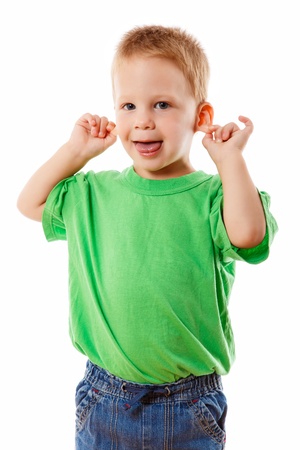Little kid with funny face, pulling himself on the ears, isolated on whiteの写真素材