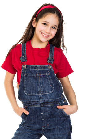 Smiling girl in coveralls, isolated on white;の写真素材