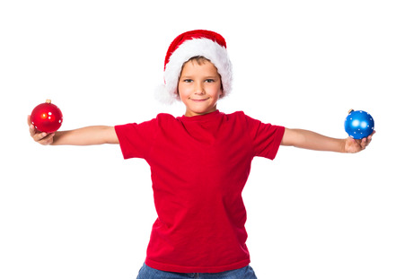 Smiling boy with christmas decoration in hands, isolated on whiteの写真素材