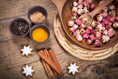 Spices for masala tea on dark wooden tableの写真素材