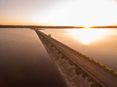 Aerial panoramic view to old road on damの写真素材