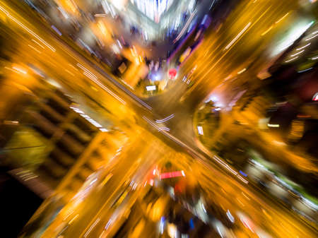 abstract blurred aerial view to crossroads with car lights and zoom effectの写真素材