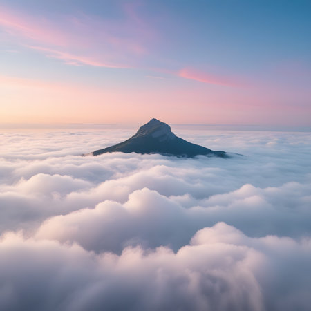Mountain top in the clouds at sunrise. Beautiful nature landscape.の素材