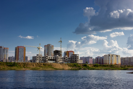Houses on the banks of the river, the view from the water.の写真素材