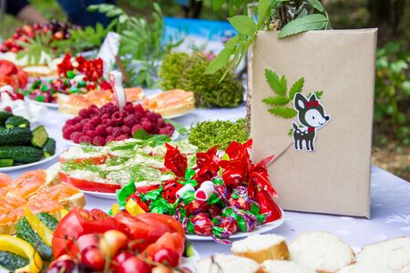 Table in the forest decorated to the birthdayの写真素材