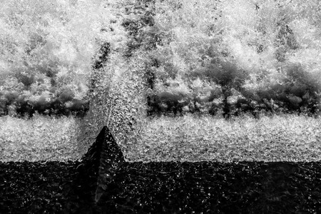 Water splashing at the floodgates over a riverの写真素材
