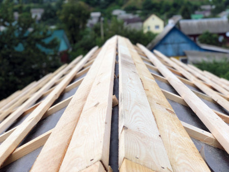 A finished roof ridge made of wood and a rafter system with a crate top viewの写真素材