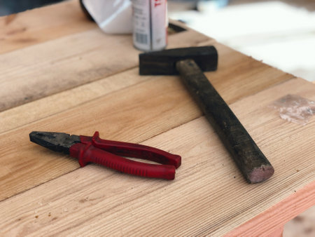 Roofer tools for carpentry work with wood on house roof