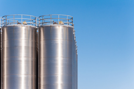 Detail of chemical plant, silos and pipes. Copy spaceの写真素材