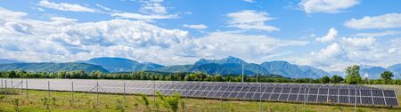 Udine,Italy  - 24 May 2015 : Landscape with solar power station and the Italian Alps in the backgroundのeditorial素材