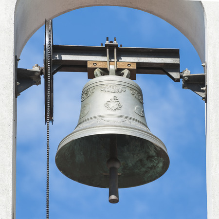 Small bell tower with a bell of a country church iの写真素材