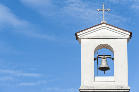 Small bell tower with a bell of a country church i