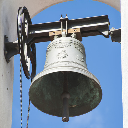 Small bell tower with a bell of a country church iの写真素材