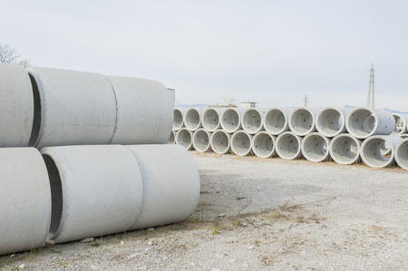 Concrete drainage pipes for industrial building construction.