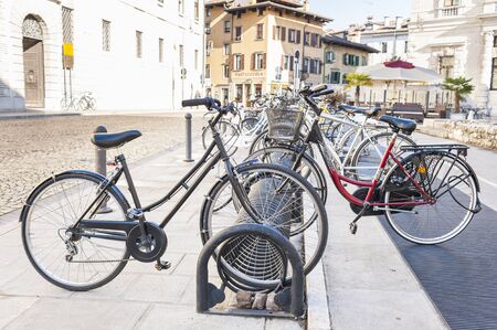 Udine,Italy - 15 anuary 2016 :   Bicycles parked in a rack in front of the University of Udine.のeditorial素材