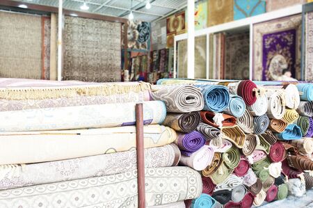 Many colorful carpets for sale  in the store.の写真素材