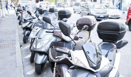 Trieste ,Italy - April 22 2016 : Motorbike, motorcycle scooters parked in row in city street.のeditorial素材