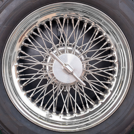 Closeup detail of an old car tyre wheel with spokesの写真素材