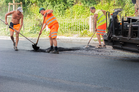 Udine ,Italy - June 28 2016 : Workers on a road construction, industry and teamworkのeditorial素材