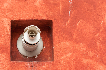 Chimney for smoke outlet on the wall. Forced circulation airtight double boiler. Outdoor flue and air intake.の写真素材