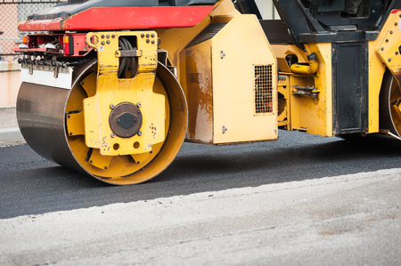 Road roller at work. Work of asphalting a road.の写真素材