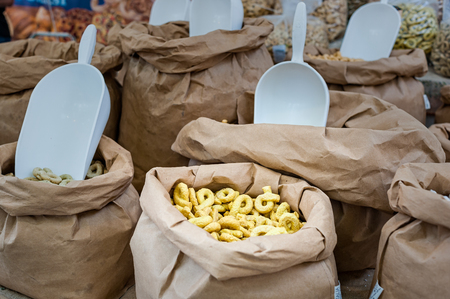 Taralli - traditional Italian snack food typical of Apulia regional cuisine on the market in Puglia in Italy.の写真素材