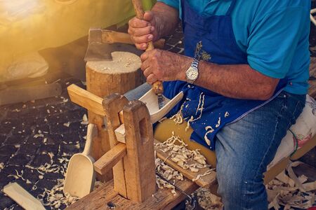 Craftsman carpenter builds wooden tools.